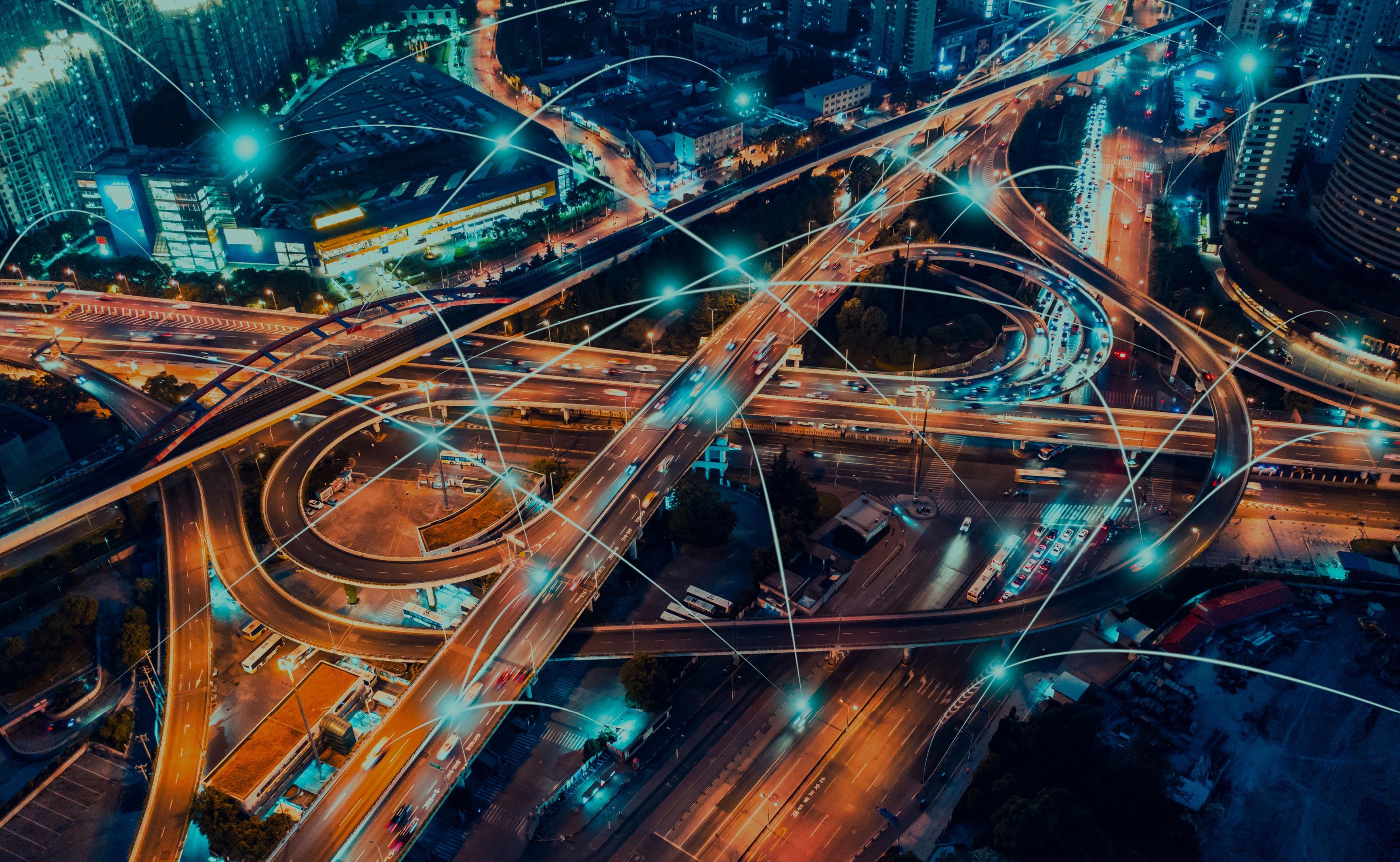 cyan and orange overhead view of busy city road junction with connected glowing lines jumping from point to point